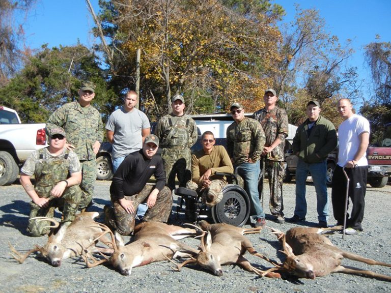 Hunters and volunteers with deer taken at Quantico