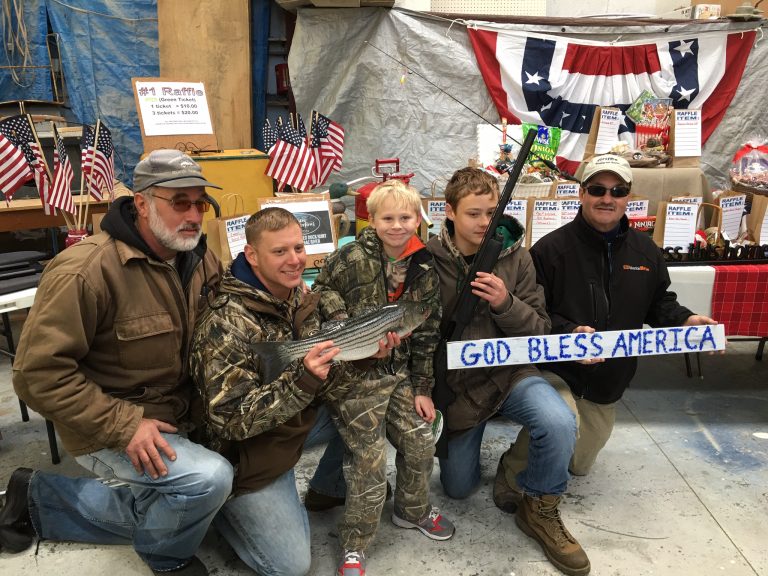 Veterans and a young hunter at a QIMSA event