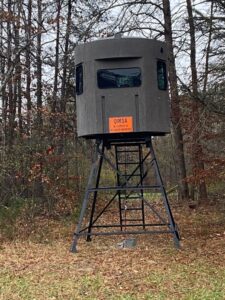 Octagonal box blind on a steel tower in the woods