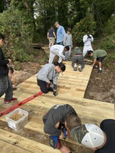 Volunteers laying boardwalk decking